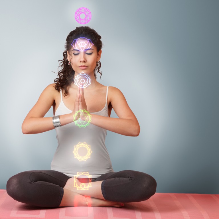 Beautiful young woman doing yoga exercise